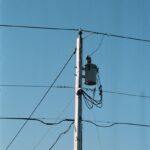 a telephone pole with a camera attached to it